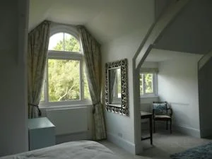 semi circle window with curtains