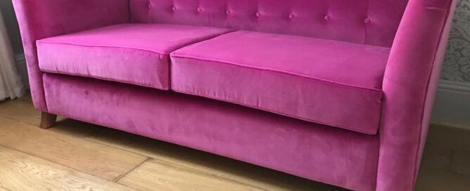 Sofa bed reupholstered in pink velvet fabricric