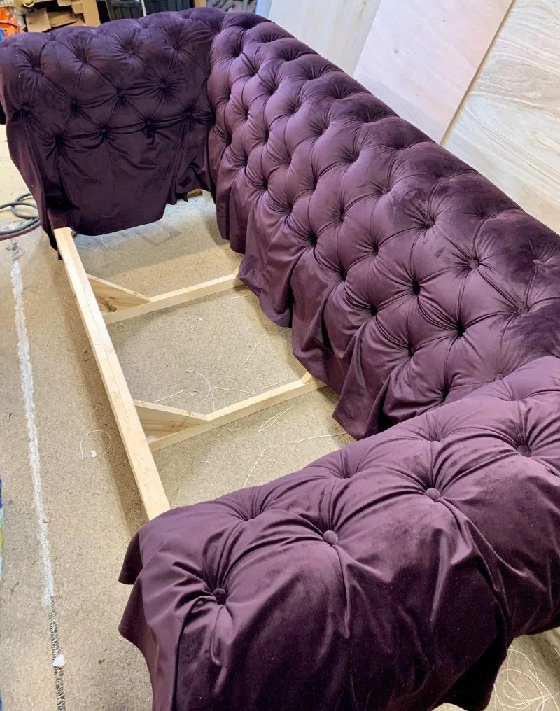 Above is a Chesterfield sofa in the progress of being re-upholstered.