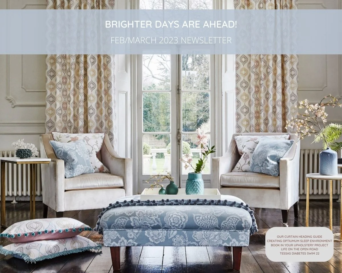 Lounge with curtains, chairs, scatter cushions and upholstered footstool