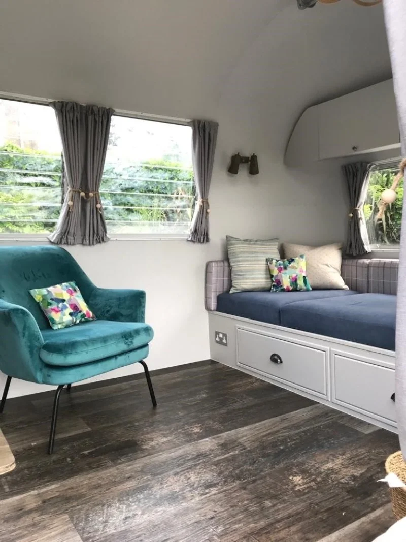 Airstream made to measure curtains, reupholstered sofa, scatter cushions and chair.