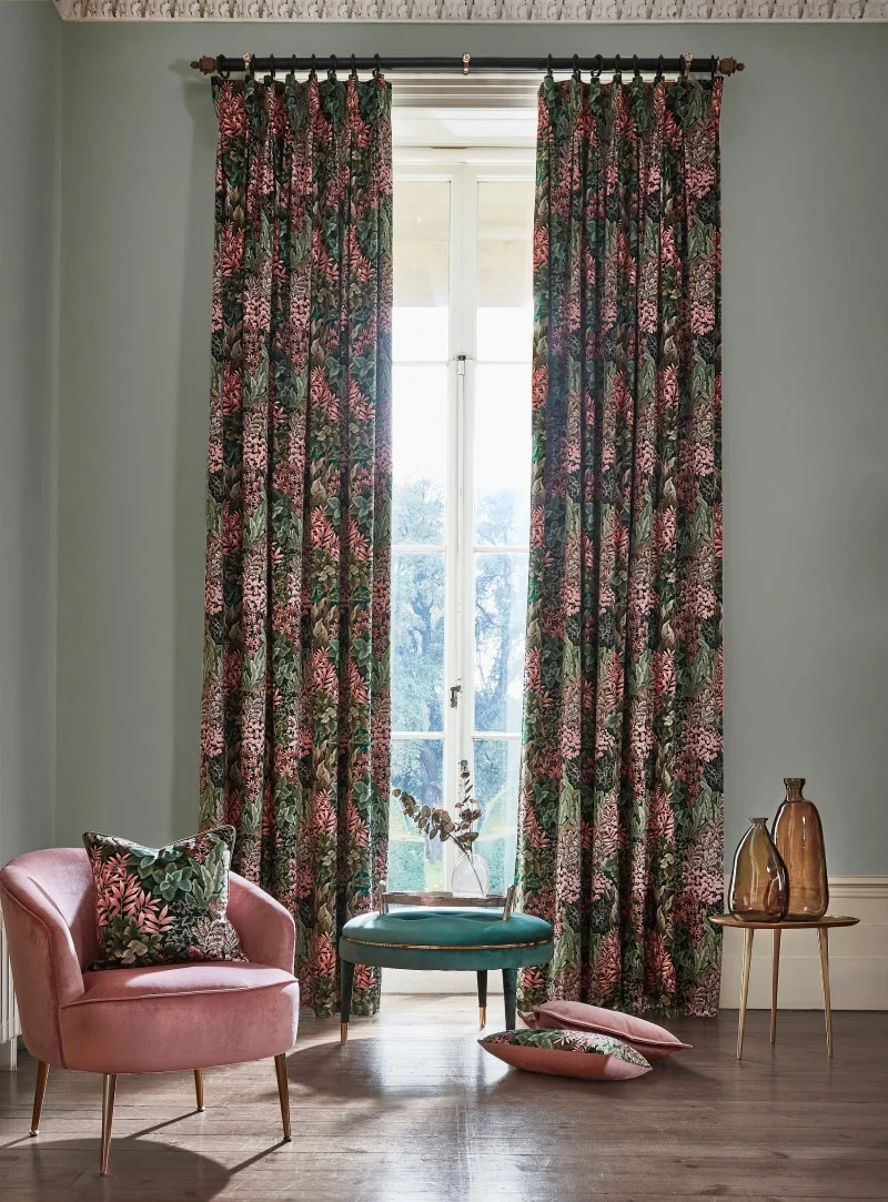 Globlet pleat curtains with cosy chair, scatter cushion, and coffee table