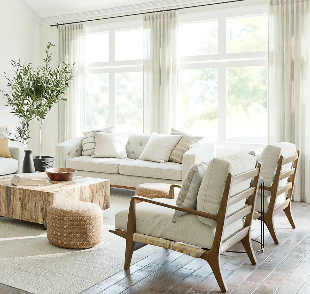Voile curtains in a sun filled lounge with sofa, two arm chairs, a coffee table and a footstool