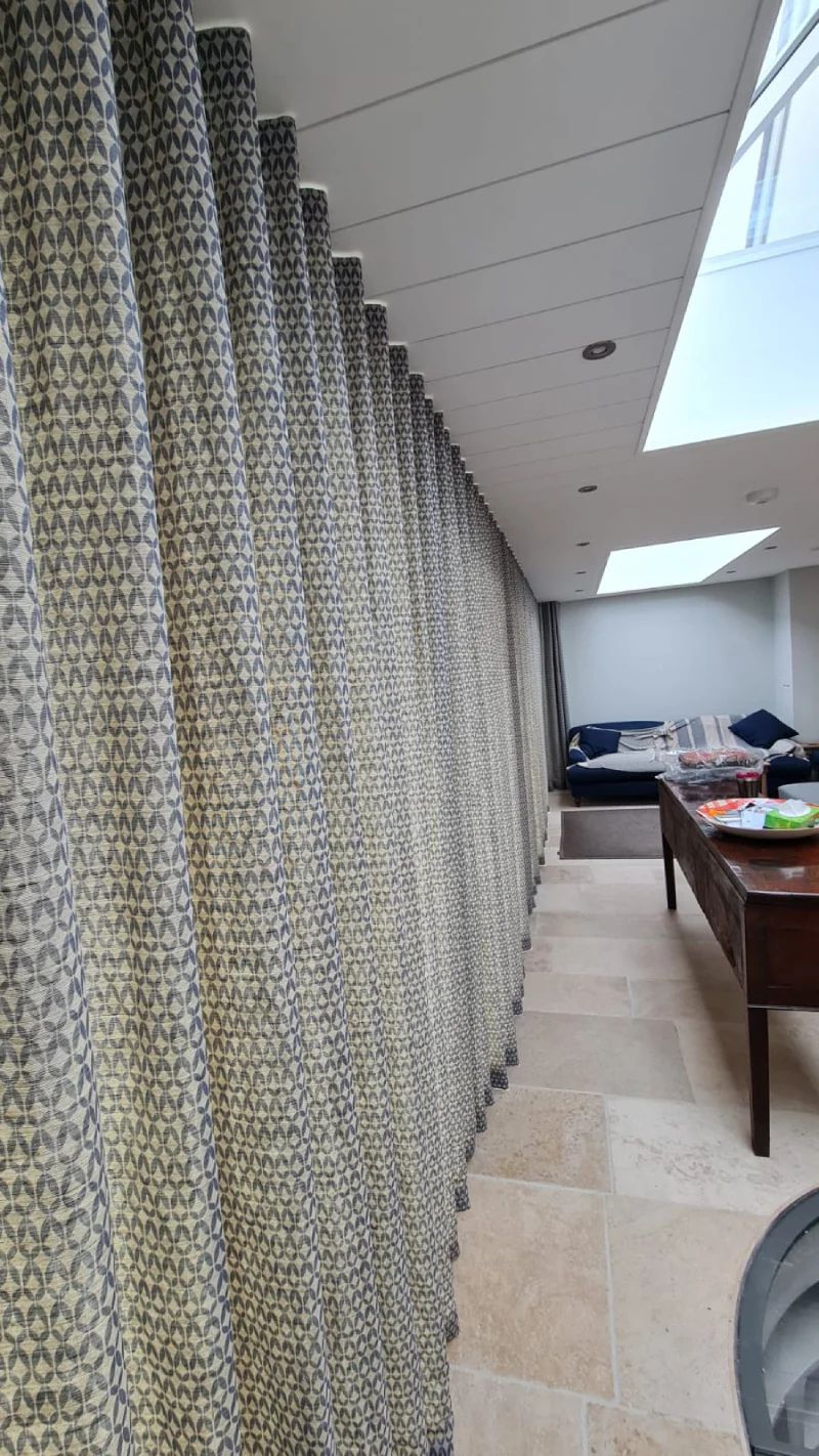 Recessed curtain track with bifold doors